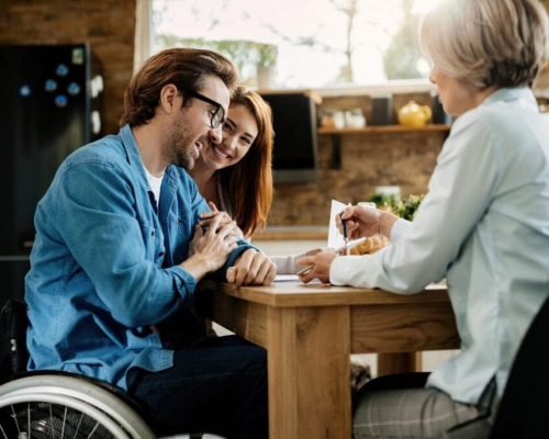 young-happy-couple-their-financial-advisor-using-touchpad-meeting-home-focus-is-man-wheelchair-e1686104661771-1024×682 young-happy-couple-their-financial-advisor-using-touchpad-meeting-home-focus-is-man-wheelchair-e1686104661771-1024x682